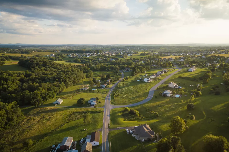 Aerial view of green rural community with houses in Pennsylvania.